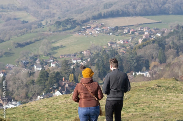 Fototapeta A couple enjoying the views on the Malvern Hills, Worcestershire.