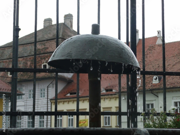 Fototapeta Water flowing along the city 