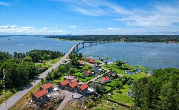 Fototapeta Coast village and bridge to Torso island on Vanern - aerial view