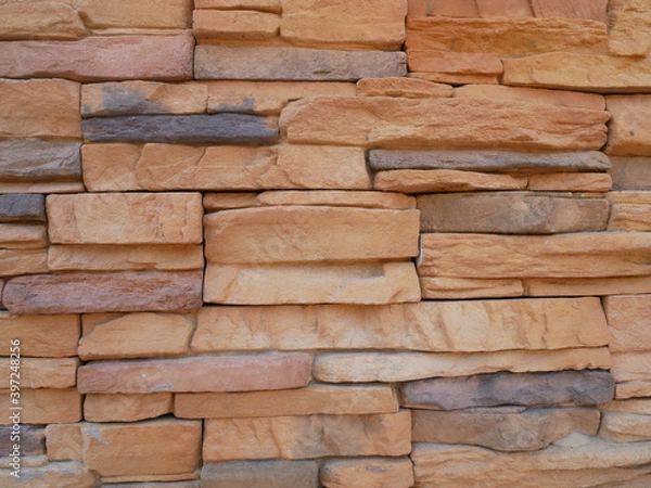 Fototapeta Slate brick in earth tone colour used as wall finishes. Installed overlap according to the method recommended by the manufacturer to get the maximum effect.