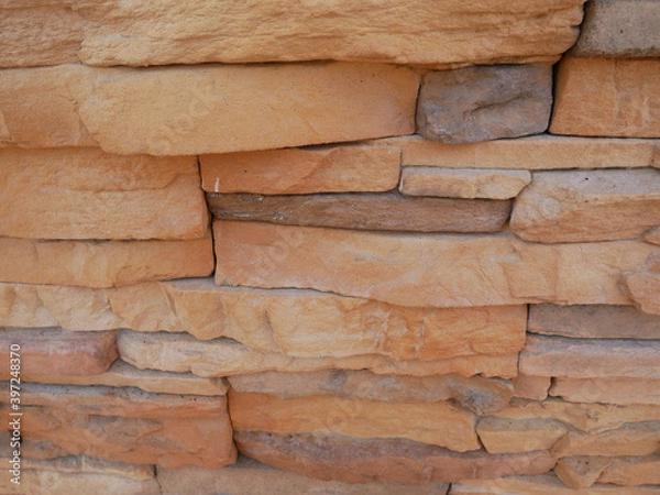 Fototapeta Slate brick in earth tone colour used as wall finishes. Installed overlap according to the method recommended by the manufacturer to get the maximum effect.