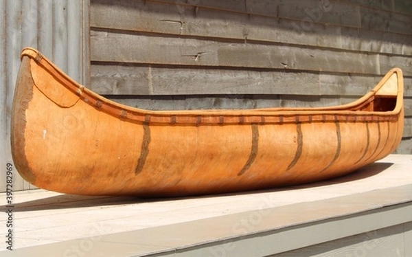 Obraz vintage indigenous birch canoe elevated on platform