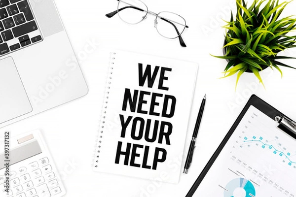 Fototapeta Text WE NEED YOUR HELP on card on office desk. Flat lay, top view.