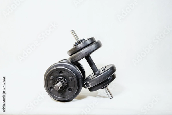 Obraz Weights on a white background. The concept of sports, exercises in the gym.