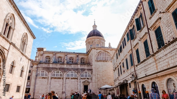 Obraz Dome of Dubrovnik Cathedral. Low angle view of Dubrovnik Cathedral and its dome with people