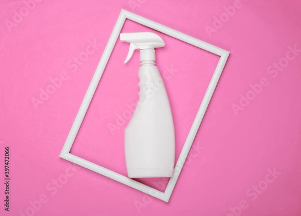 Obraz Bottle of spray for washing windows on pink background with a white frame. Top view. Minimalism