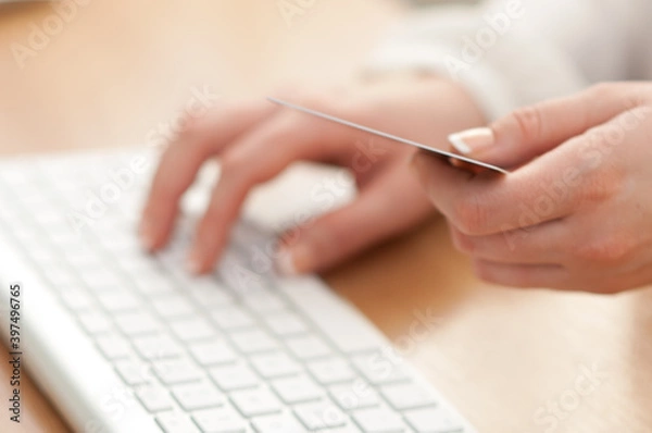 Fototapeta Using computer and credit card for online payment