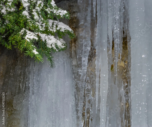 Fototapeta closeup frozen waterfall  in the mountain canyon