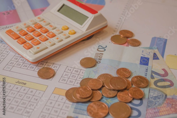 Fototapeta debt collection and tax season concept with deadline calendar remind note, coins, calculator on table, background, time to pay concept