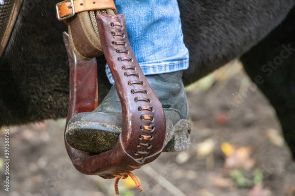 Obraz close up of a boot in stirrups