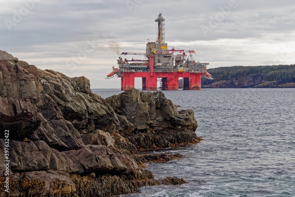 Fototapeta Deep water drill rig is moored near shore after finishing an exploration well, Newfoundland and Labrador, Canada.