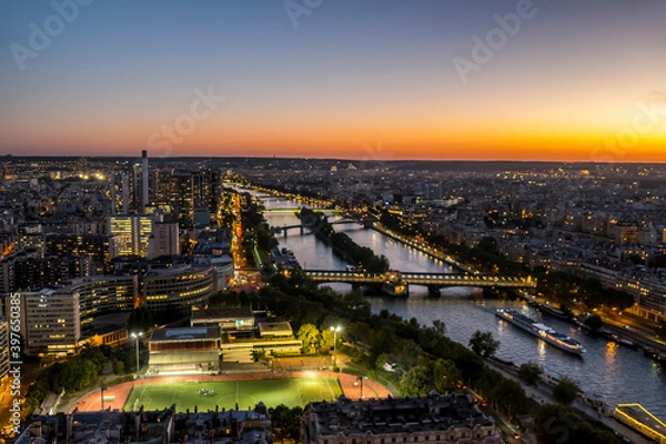 Fototapeta Aerial view of Paris and the Seine River at sunset