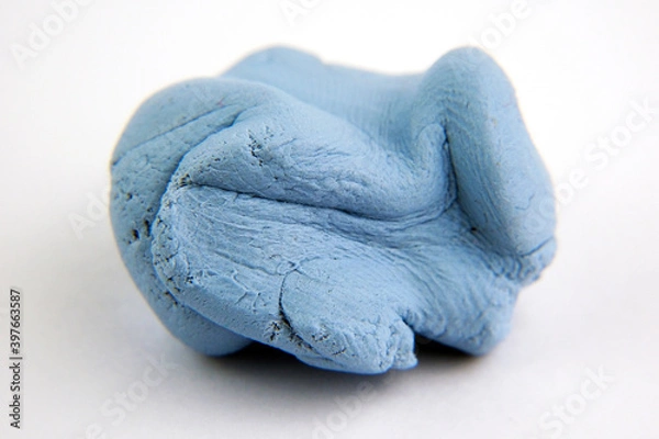 Obraz Blu Tack with visible grainy texture. Photo with selective focus. Macro photo