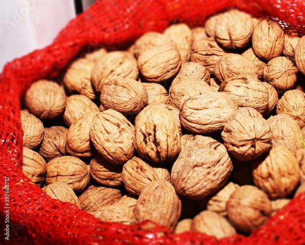 Obraz Walnuts in burlap bag