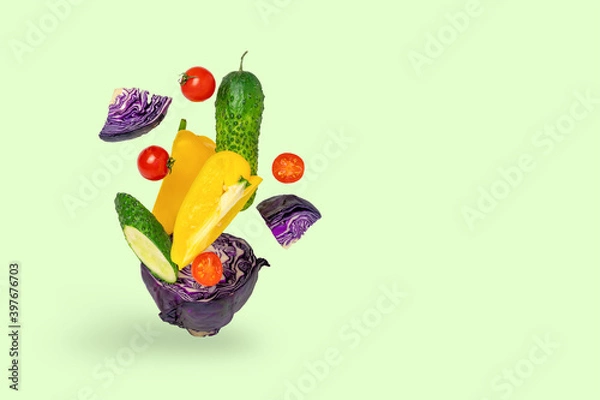 Obraz Fresh vegetables, salad ingredients, on a green background.