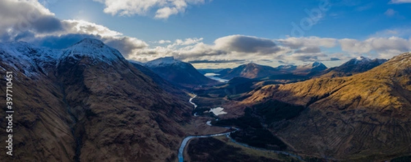 Fototapeta aerial view of glen etive in winter near rannoch moor in the argyll region of the highlands of scotland showing snow dusting on the mountains and munros