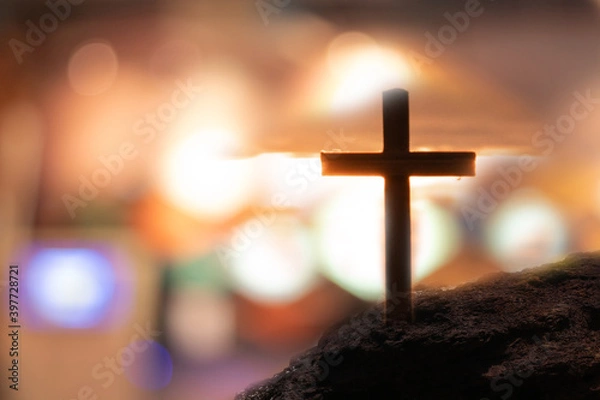Fototapeta Crucifix jesus christ With light background blur bokeh