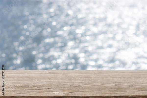 Fototapeta Wooden decking with space for placement of advertising materials. And has a blurred background, bokeh, can be used as a background advertising