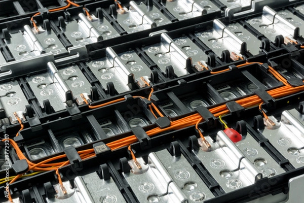 Fototapeta Selective focus of Electric car lithium battery pack and wiring connections internal between cells on background.	