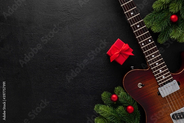 Obraz Christmas music. Flat lay composition with guitar and fir tree branches