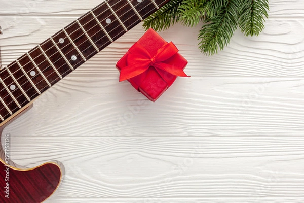Obraz Christmas music. Flat lay composition with guitar and fir tree branches