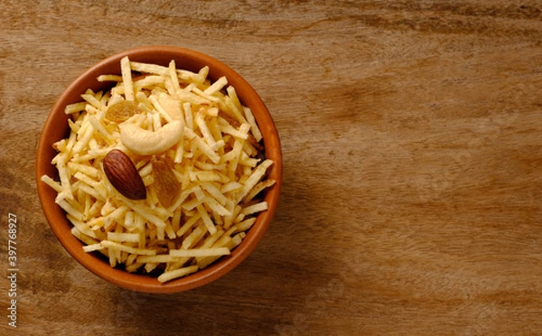 Fototapeta Indian style deep fried snacks falahari chivda- chivda or mixture namkeen with dry fruits.