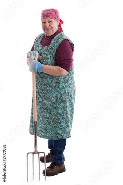 Obraz Aktive Seniorin hält Mistgabel