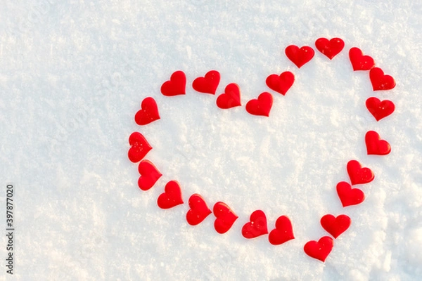 Fototapeta Big red heart on snow. Background for Valentines day greeting card, concept of romantic celebration, winter wedding