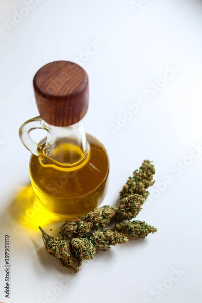 Fototapeta Jar with hemp oil, bud on white background, top view
Medical Cannabis concept
