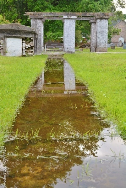 Obraz water path to structure in cemetery