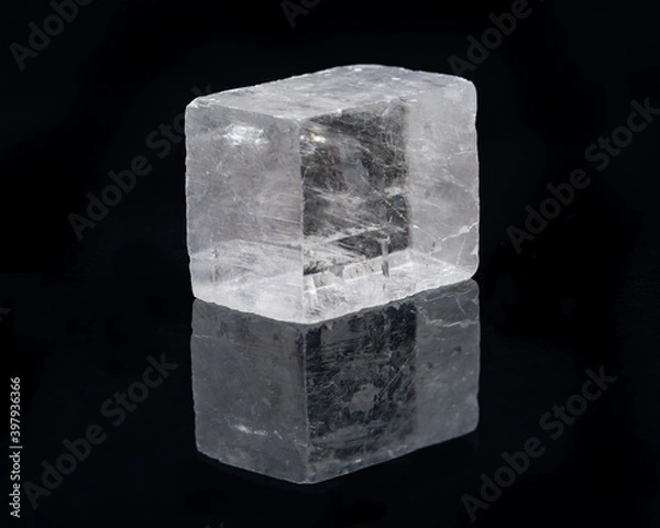 Obraz Optical Calcite from China isolated on a black mirror background. Alternative stone name: Iceland Spar.
