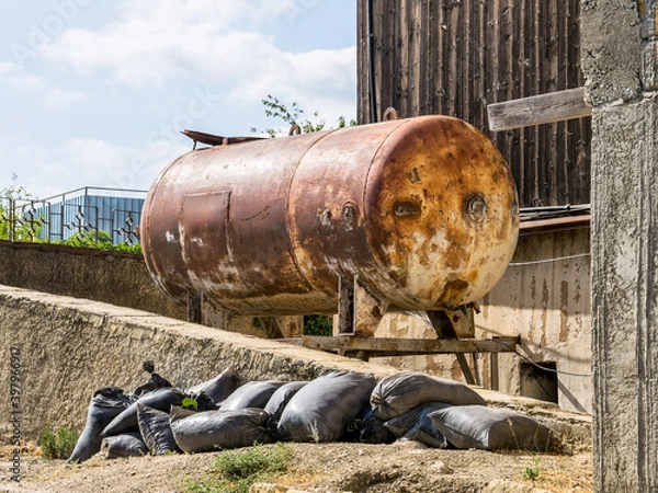 Fototapeta Old rusty metal cistern
