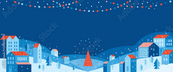 Fototapeta Urban landscape in a geometric minimal flat style. New year and Christmas winter city among snowdrifts, falling snow, trees and festive garlands. Abstract horizontal banner with space for the text