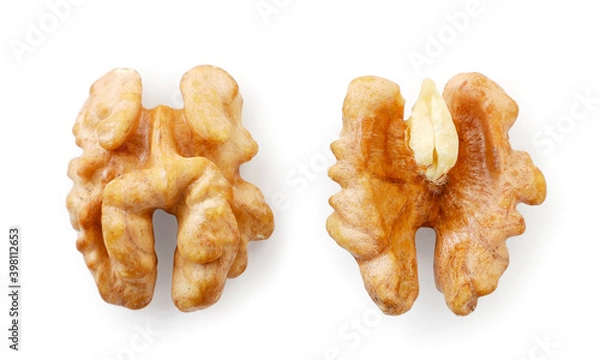 Obraz Two halves of a walnuts kernel on a white background. Top view.