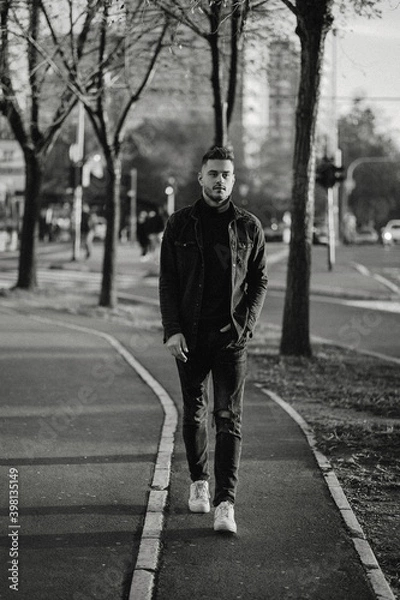 Obraz person walking on the road