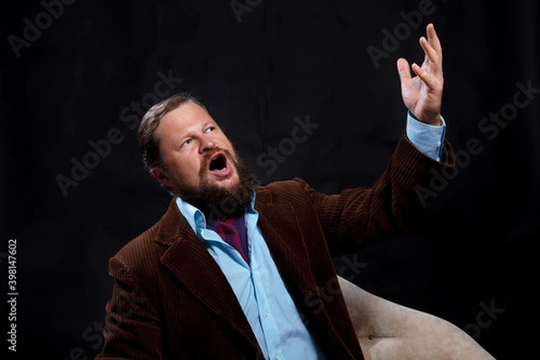 Fototapeta Stylish bearded man dressed in suit singing opera