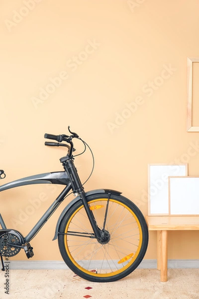 Fototapeta Interior of modern room with bicycle and blank photo frames