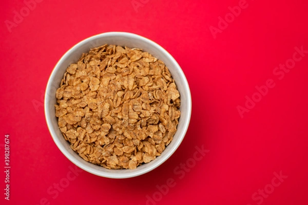 Fototapeta flakes wheat in the bowl