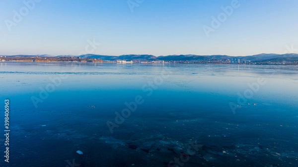 Fototapeta The sea in the background of the mountains near vladivostok photographed on a drone