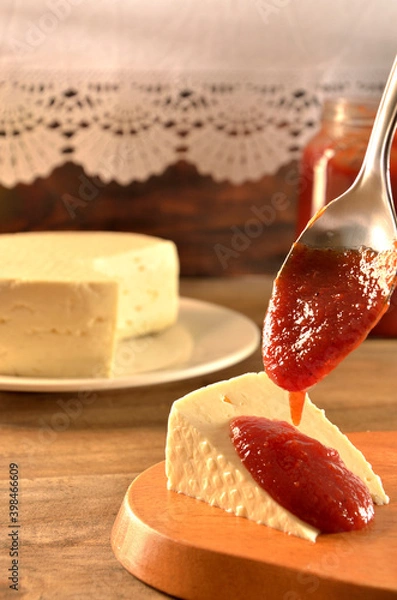 Fototapeta white cheese with a spoon of guava