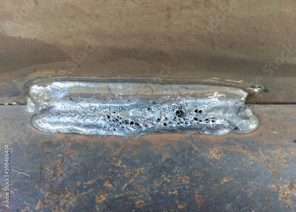Fototapeta Porosity or worm hole in weld, Defect of welding process Flux Cored Arc Welding (FCAW)
