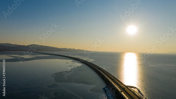 Fototapeta Winter views of The Amur Bay Bridge, photographed on a drone