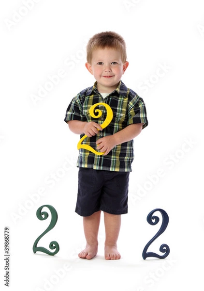 Fototapeta A Two Year Old Holds a Number Two