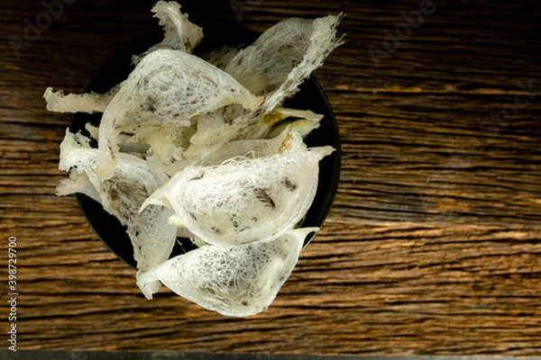Fototapeta Topview swallow's nest on the wood floor close up
