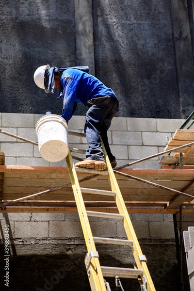 Fototapeta Unsafe use of a ladder and scaffold