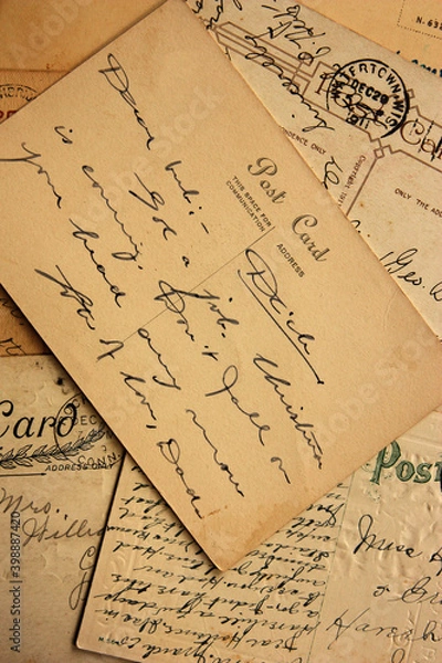 Fototapeta Reverse side of an old post card with the postage stamp and handwriting, circa 1915