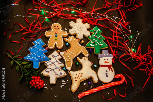 Fototapeta Gingerbread Christmas symbols, cookie set on a black background.