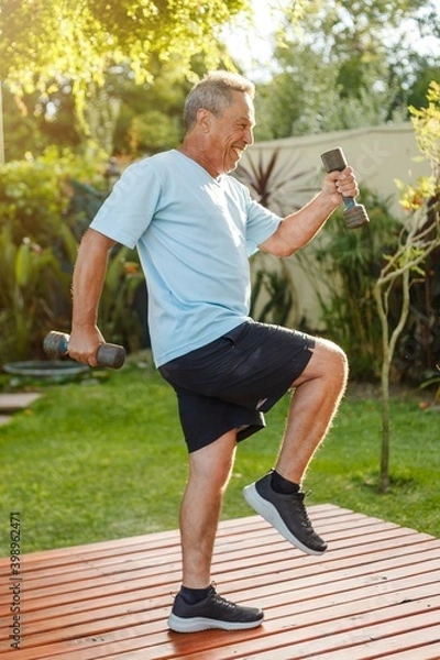 Obraz senior person exercising with dumbbells