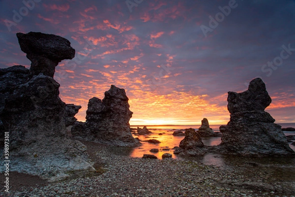 Obraz Typical limestone rocks from Gotland. They are called rauks or rauk-fields. Sunrise over the Baltic Sea.
