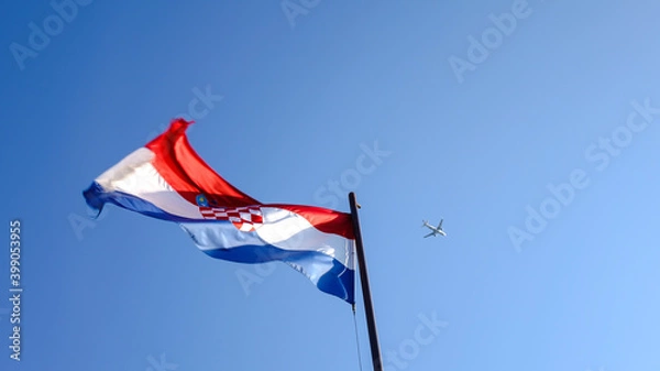 Fototapeta Croatian flag and an airplane shot from below
